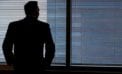 Businessman staring out of window In desperate times, business owners must shift strategies