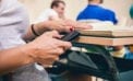 Student using cell phone in the classroom Technology has proven itself to be a double-edged sword