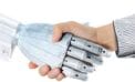 Robot shaking hands with man The ecological upside to job automation