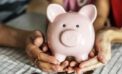 piggy bank hands money savings How we can each deal with inflation